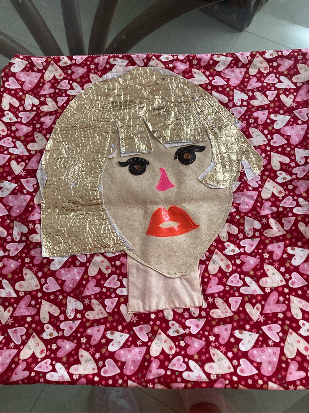 Gold-Haired Face Applique Pillow Panel on Red Heart Fabric